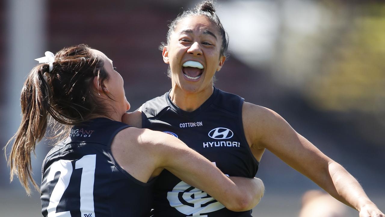Darcy Vescio, right, celebrates a goal with teammate Georgia Gee during the 2021 season. Picture: Dylan Burns/Getty Images