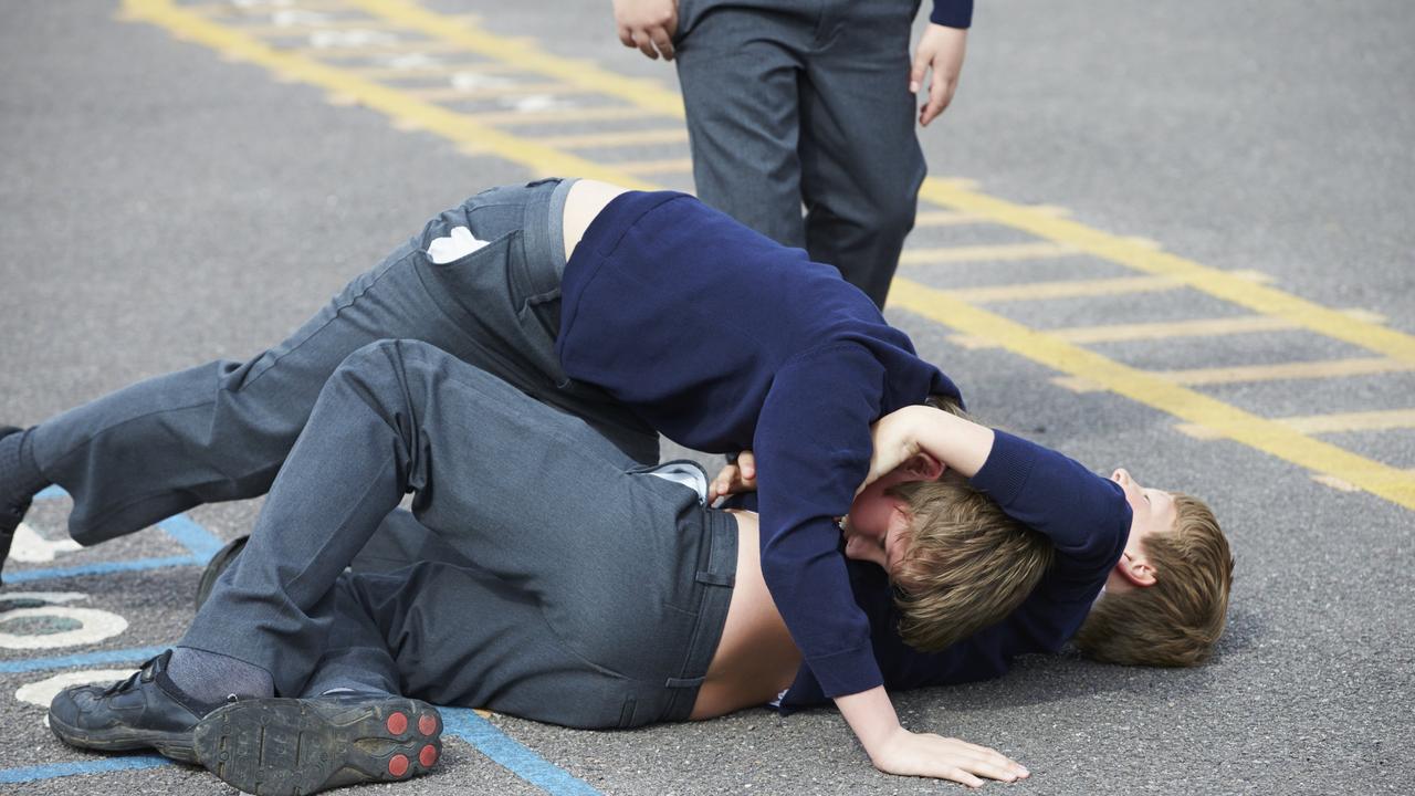 Two Boys Fighting In School Playground