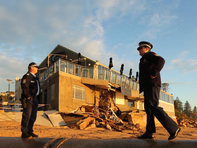 Police this morning outside the battered Collaroy Beach Club. Picture: John Grainger