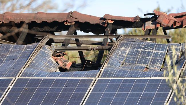 Flames shot through the roof, melting solar panels on top. Picture: Russell Millard