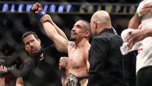 Robert Whittaker celebrates after his victory over Yoel Romero.