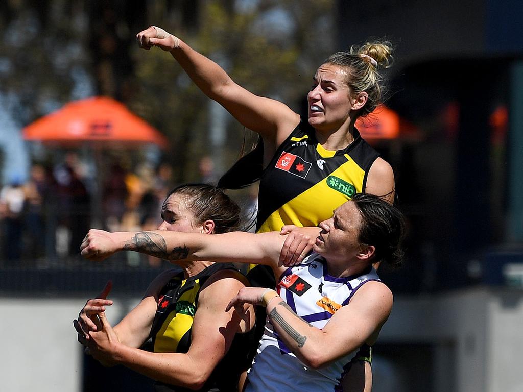 Richmond defenders thump the ball away from Makaela Tuhakaraina. Picture: Morgan Hancock/Getty Images