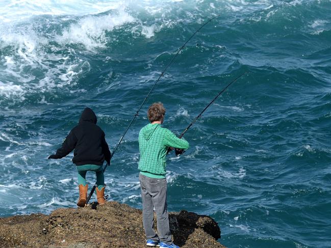 Rock fishermen at notorious Snapper Point where many people have been swept to their deaths. Picture by Peter Lorimer.