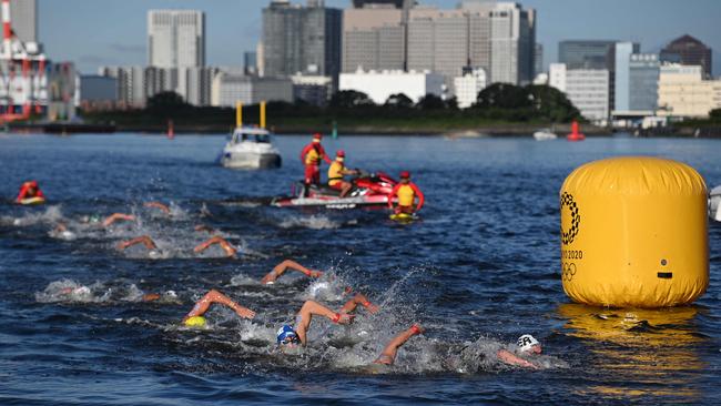 Germany's Florian Wellbrock, right, leads the field on his way to gold in the men's 10km marathon swimming. Picture: Oli Scarff/AFP