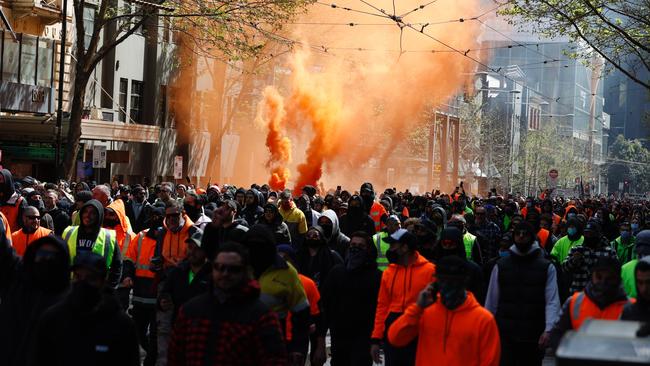 Protesters set off flares. Picture: Alex Coppel