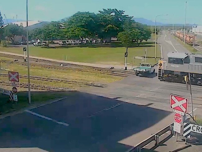 A vehicle is almost hit by a train at Benwell Road, South Townsville, on March 24, 2022.