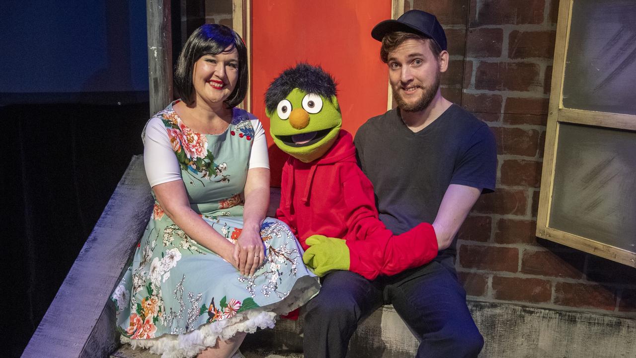 OPENING NIGHT: Jo Tooley, dressed as her character Christmas Eve, sits with castmate Ryan Paroz and puppet Nicky on the set of Avenue Q at the Empire Theatre. Picture: Nev Madsen