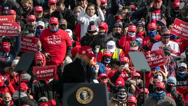 Supporters listen as President Donald Trump speaks at a campaign rally in Washington, Michigan. Picture: AFP