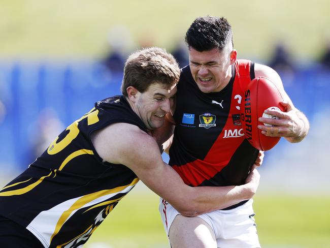 Tigers’ Tyler Carter tackles Bombers’ Arion Richter-Salter. Picture: ZAK SIMMONDS