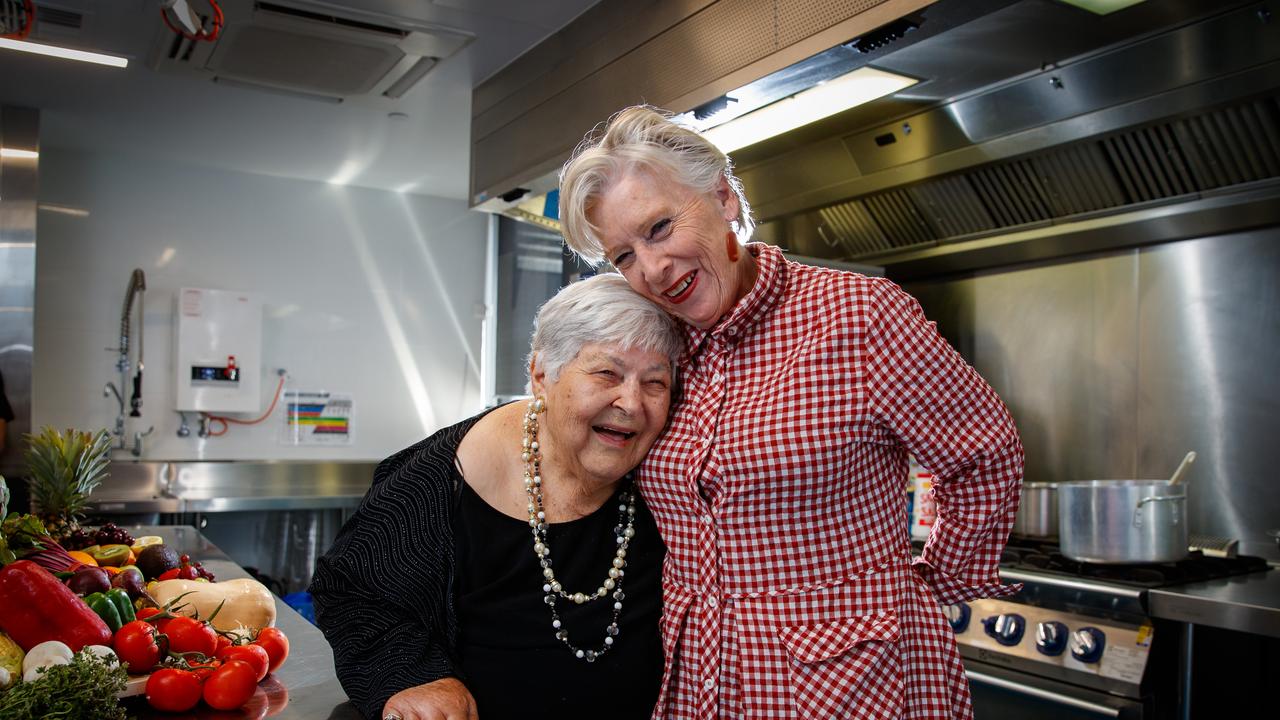 Maggie Beer and her friend Zeffie, 90, stir up some Christmas cheer at an Adelaide aged care home in 2019. Picture: Matt Turner