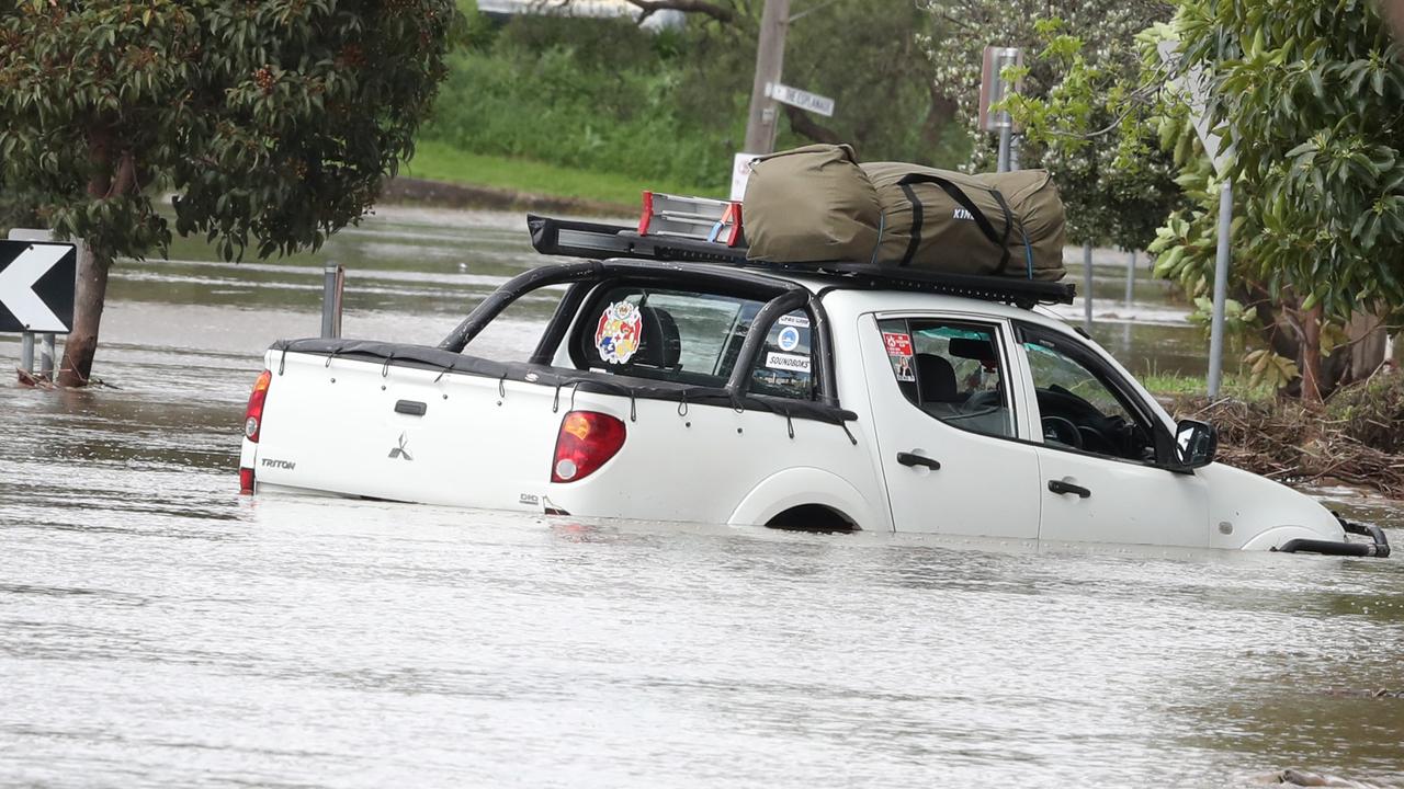 A truck in floodwaters on the Esplanade in Maribyrnong. Picture: David Crosling