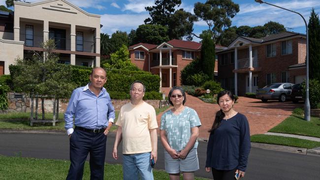 L-R Cr Vince del Gallego photographed with residents Paul Ho & Kate & Kate Chan. Picture / Monique Harmer