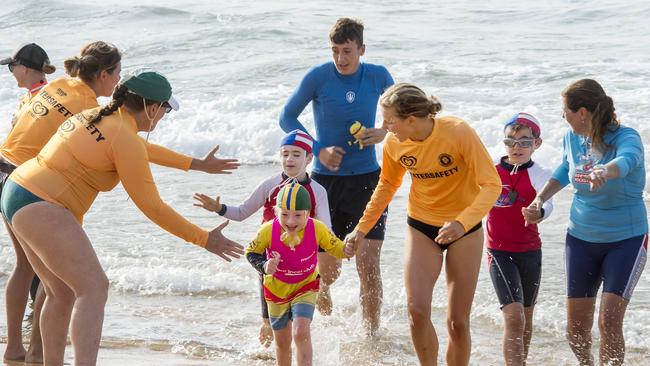 Avoca Beach competitor Oren Barlow (middle) in action during the beach wade. Picture: Troy Snook