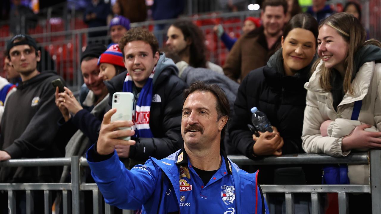 Bulldogs head coach Luke Beveridge poses with fans after winning on the road in Sydney. Picture: Cameron Spencer/Getty Images