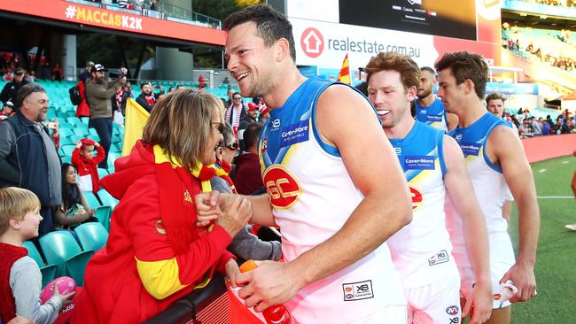 Steven May leads his teammates off the ground after their stunning win over the Swans. Picture: Getty Images