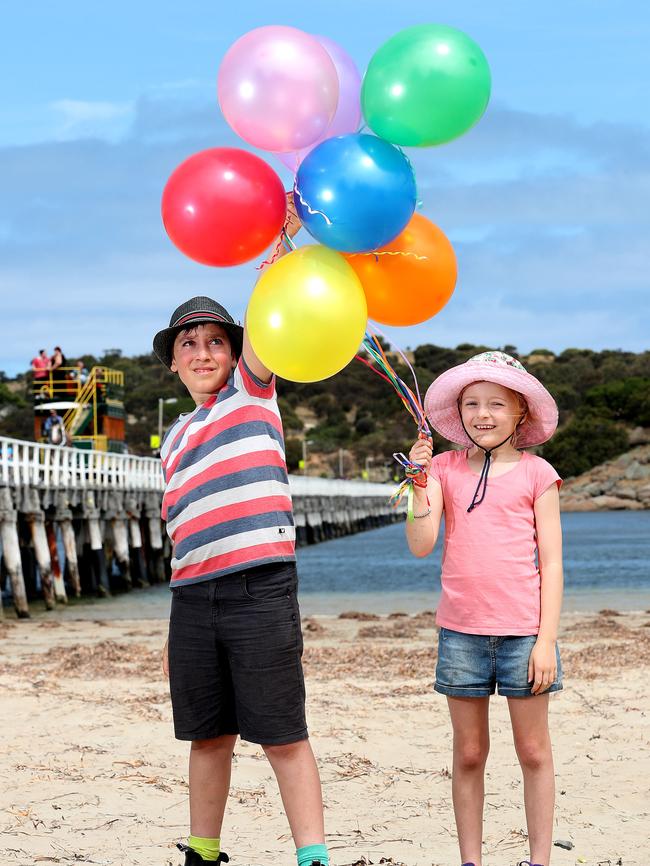 Lila and Oscar play with balloons at Victor Harbor. Picture: Dylan Coker