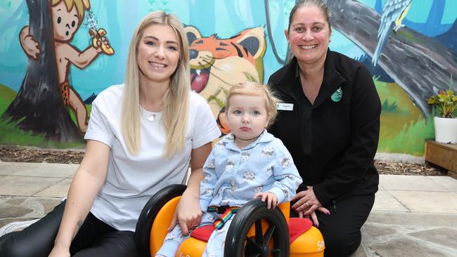 Winnie Hyett with her mum Lucy Allabin (left) and Sparrow Early Learning second in charge Lauren Fountain. Picture: Glenn Hampson.