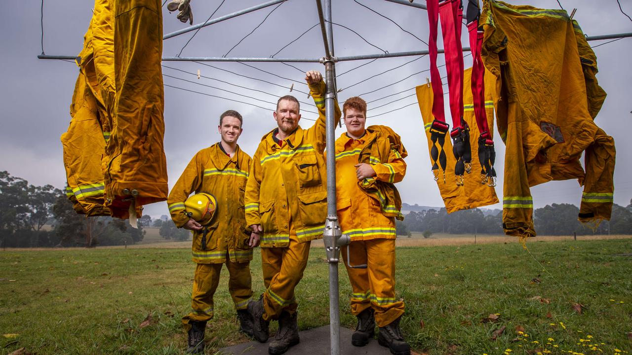 <b>THE HARDACRES</b> <br/> <i>Ruby Fire Brigade<br/> South Gippsland, Victoria<br/>Combined years volunteering: 34</i> When duty calls in the Hardacre household, there’s no shortage of family members ready to pull on the heavy, bright yellow outfit of the Country Fire Authority ­volunteer. Darren Hardacre — a CFA veteran for 25 of his 49 years — and sons Nathan, 22, and Tim, 19, jumped when the call went out for volunteers to deploy to the epicentre of Victoria’s bushfire crisis: East Gippsland. They formed part of a five-person strike team from Ruby Fire Brigade that left in early January this month to support some of the hardest hit communities. “It was a pretty proud moment to be out there with my two boys,” Darren 49, Hardacre says. “I was the captain when they were born so they’ve just grown up around it and knew no different. Every Sunday we would test the appliances and I’d always just bring them along.” Hardacre and his sons, from the tiny town of Ruby in South Gippsland, were entering towns on the verge of collapse as thousands fled for their lives. It was the first time they had been deployed together. “We started our shift at 3am protecting Nowa Nowa near Lakes Entrance. Sometimes we wouldn’t get back to camp until 4pm.” Nathan, an electrical engineer, and Tim, a university student, joined Ruby CFA aged 16.And for the Hardacres, firefighting is certainly a family affair. Their late great-grandfather was a Ruby CFA member and their 71-year-old grandfather is still on the team, along with their mum and Darren’s wife, Karen. “My daughter is hoping to join as well,” Darren Hardacre says. “It’s a great way for kids to learn about community values and develop a skillset.” Picture: Wayne Taylor