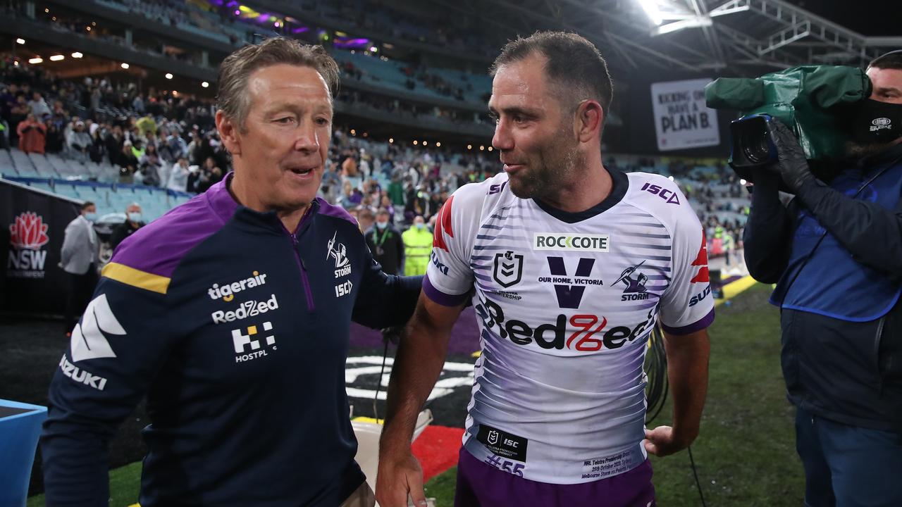 Cameron Smith of the Storm celebrates with Storm coach Craig Bellamy after winning the 2020 NRL Grand Final match. Picture: Cameron Spencer/Getty Images