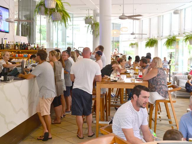 Tourists enjoying the hospitality on Hastings Street, Noosa Heads. On The Beach.