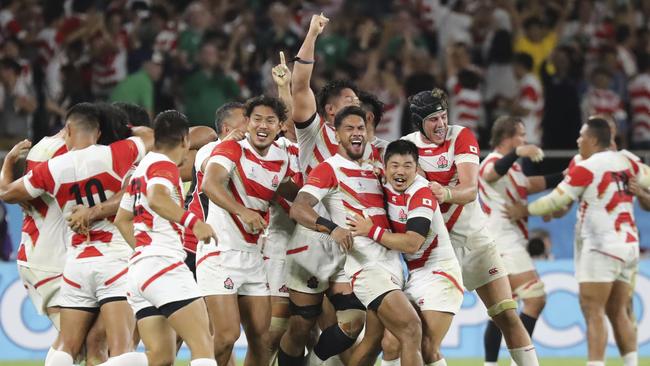 Japan's players celebrate after winning over Ireland during the Rugby World Cup Pool A game at Shizuoka Stadium Ecopa between Japan and Ireland in Shizuoka, Japan, Saturday, Sept. 28, 2019. (AP Photo/Eugene Hoshiko)