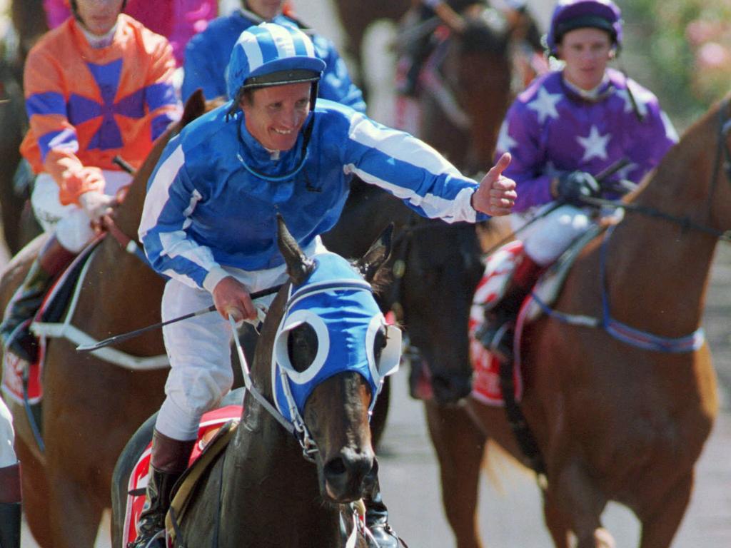 Horseracing - racehorse Amalfi ridden by jockey Damien Oliver returning to scale after winning <span><a class=