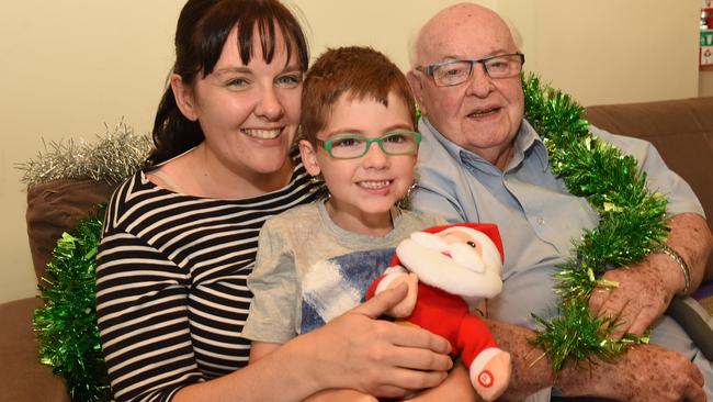 Father Bob Maguire with Belinda McNamara and her son Ty, 7. Picture: Chris Eastman