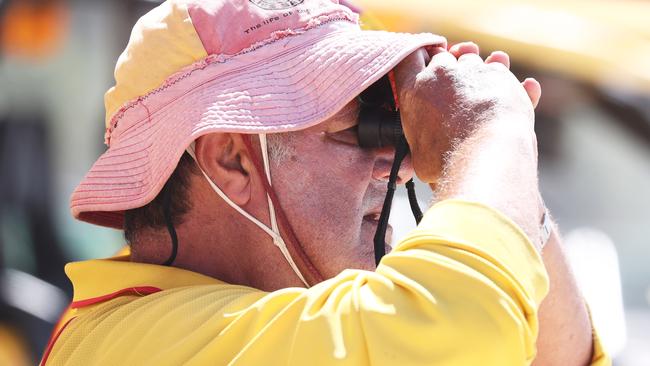 A lifesaver looks on at Burleigh Heads after a recent run of shark sightings on the Gold Coast. Photograph: Jason O'Brien.