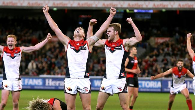 Bernie Vince and Jack Watts celebrate the 2014 victory of the Bombers.