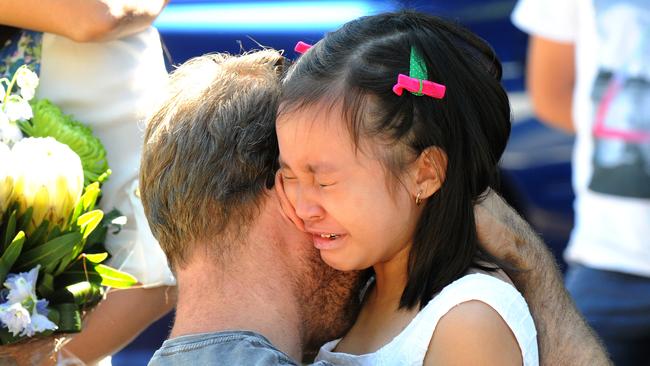 Josh Martin during his emotional meeting with Rihanna Milabo, the seven-year-old saved from a rip by his brother Ryan in a dramatic rescue that claimed his life. Photo: John Gass