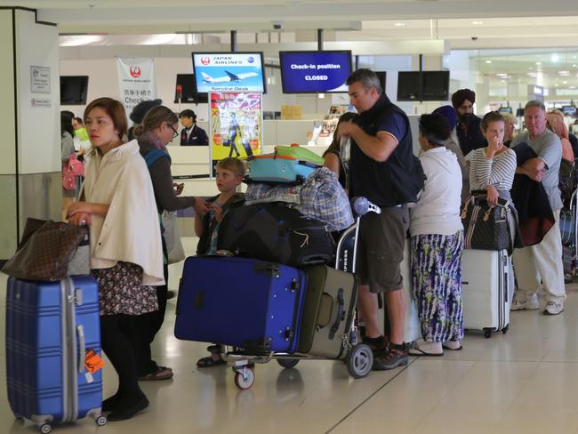 People at the Sydney international Airport during a strike by customs officers could cause some delays in boarding international flights today. Some long cues seen at some check ins but the departures gate was clear .pic John Grainger