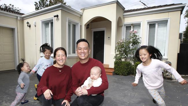 Vendors Selina and Shaun Le with Madelyn, Adelyn, Archer and Rosalyn. Picture: David Caird