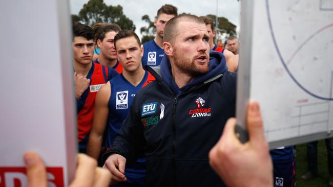 Coburg coach Leigh Adams speaks to his players last year.