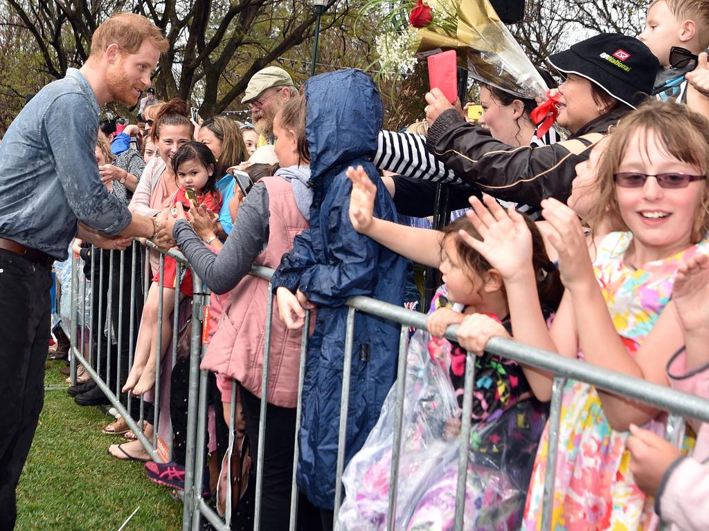 Nobody cared about getting wet while the royals were in town. Picture: Peter Parks/AAP