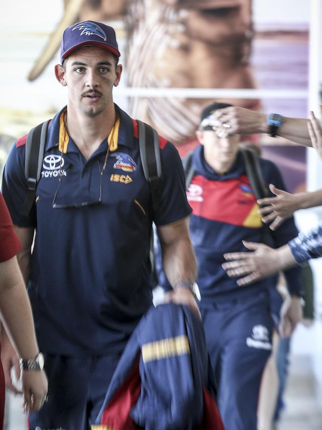 Crows captain Taylor Walker arrives at Adelaide Airport on Sunday afternoon. Picture: Mike Burton/AAP