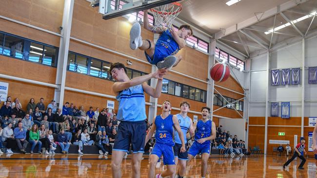 Jakes Miles-Wrency slams it home. GPS First V basketball round one action between Churchie and Brisbane Grammar.