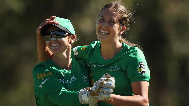 Tess Flintoff (right) celebrates after taking a wicket for Melbourne Stars in the WBBL last season.