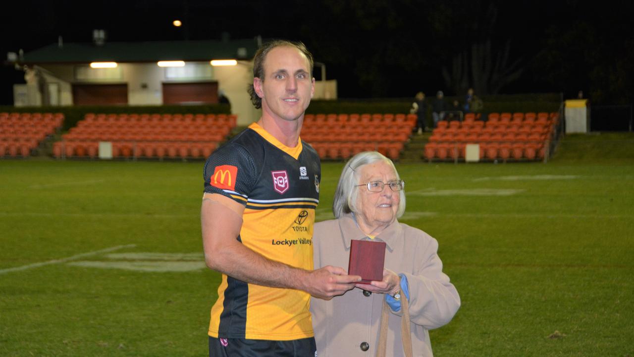 Gatton fullback Luke Self being presented with the Bill and Stephen Pollard medal for best on field in the Madsen Rasmusen Cup against Valleys.