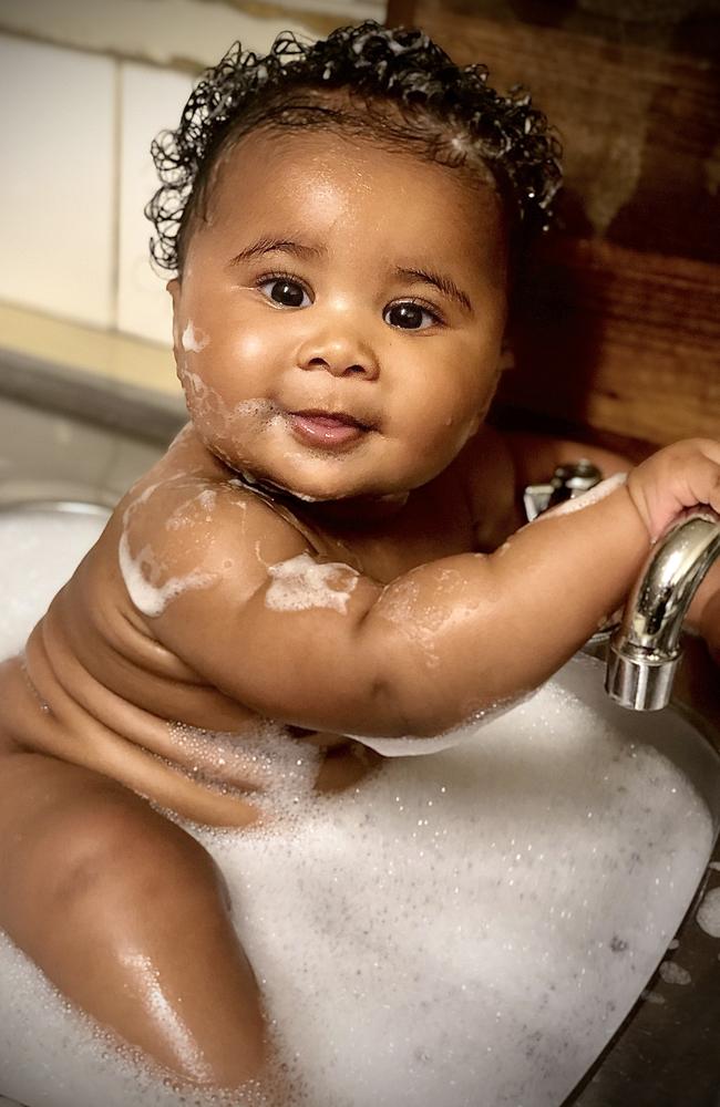 1. Nevaeh has her rolls out, and is having a fun bath in the sink. Picture: Nick Armstrong.