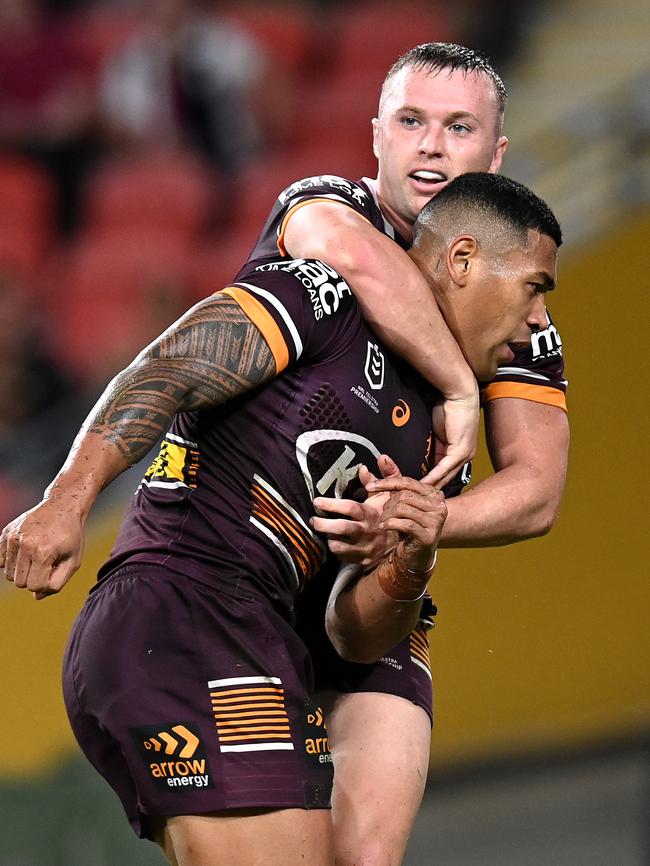 Jake Turpin congratulates Jamayne Isaako after a try. Picture: Bradley Kanaris/Getty Images