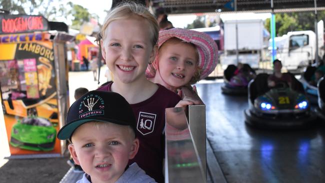 Ruby Lacey, Kaylee Symonds, and Lincoln Lacey of Bowen getting ready for their go on the dodgem cars. Picture: Kirra Grimes