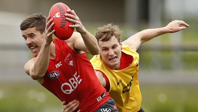 Jake Lloyd gets away from teammate Jordan Dawson at Swans training. Picture: Ryan Pierse/Getty Images