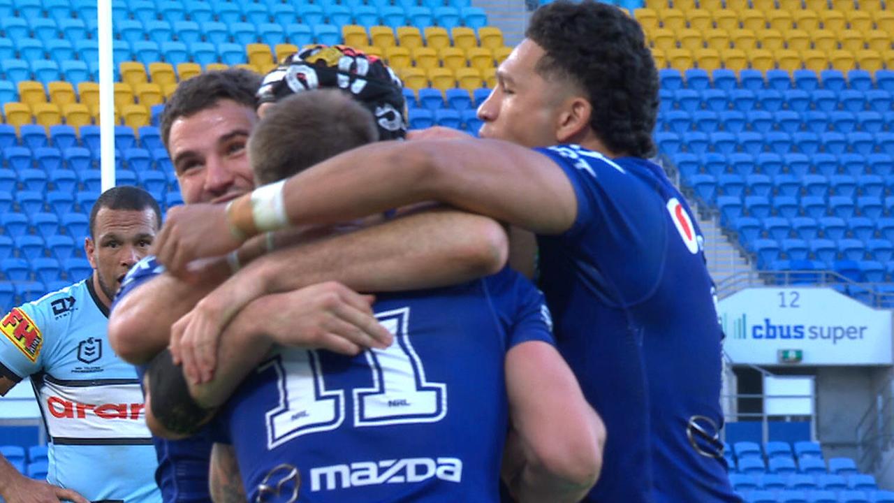 Warriors players celebrate a try.