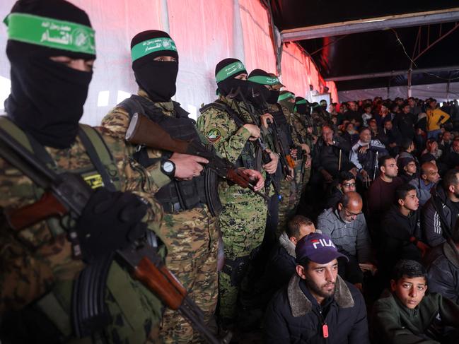 Palestinians and Hamas fighters attend a funeral ceremony for 40 militants and civilians killed during the war with Israel, at the Shati camp for Palestinian refugees north of Gaza City on February 28. Picture: AFP