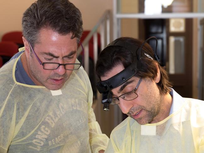 Facial Plastic Surgeons Dr Neil Gordon (left) and Dr George Marcells, AAFPS President, demonstrate advanced facelift techniques during a workshop held as part of the 2016 AAFPS Facelift and Neck Symposium.