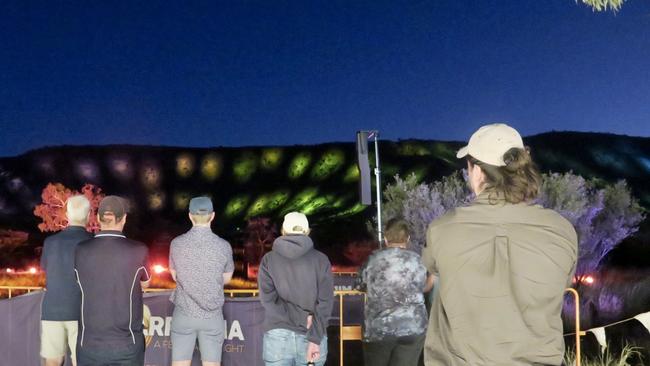 The light show illuminating the MacDonnell Ranges from Desert Park.