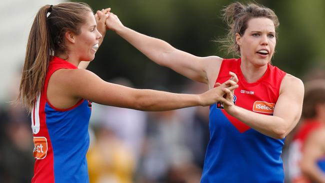 Kate Hore and Elise O'Dea celebrate a goal.