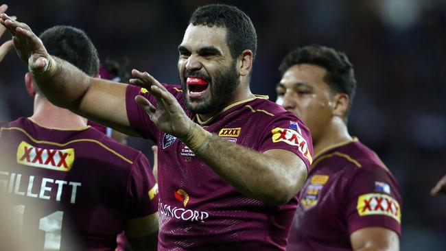 Greg Inglis celebrates a Queensland try.