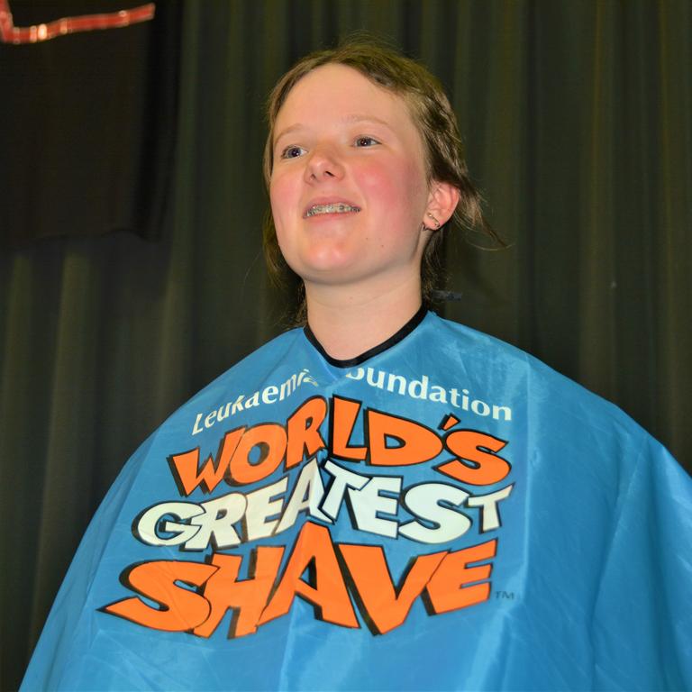 At the St Joseph's College 2023 World's Greatest Shave event is Meghan Ellis getting her cut by hairdresser Caitlin Symes from the Hair Room on Russell. Picture: Rhylea Millar