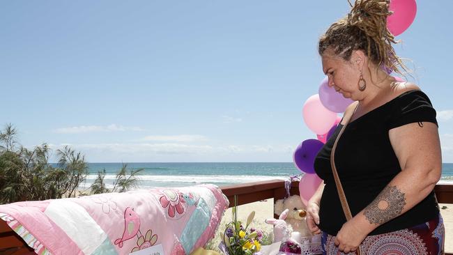 Jodie Devere of the Gold Coast pays tribute to the baby that was found dead on the beach in Surfers Paradise near Staghorn Ave. Photo: Tertius Pickard